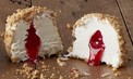 Cheesecake flavoured icecream with strawberry sauce centre and decorated with crushed biscuit